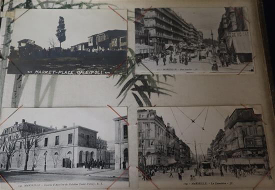 A 1920s Japanese lacquered postcard album with continental topographical cards, thirty one Victorian